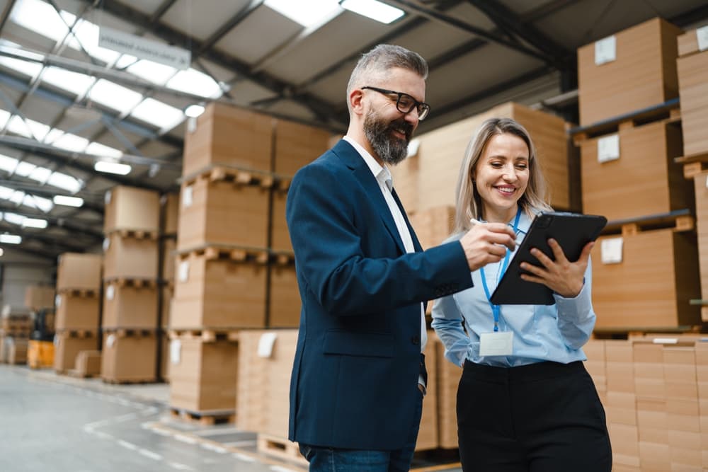 Two managers performing checks using retail inventory management software
