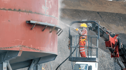 construction worker performing sandblasting