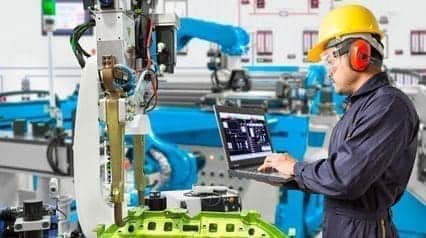 an engineer ensuring customer specific requirements are being met on the manufacturing plant