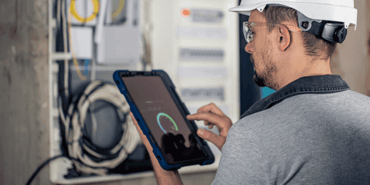 Worker assessing advanced metering infrastructure
