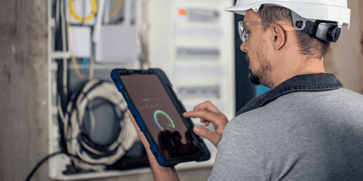 Worker assessing advanced metering infrastructure