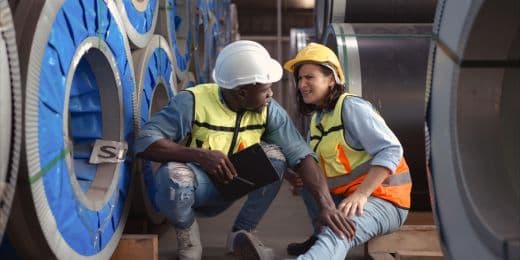 a safety officer assisting an injured worker according to workplace injury reporting best practices