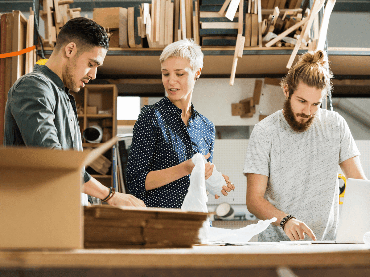 Manufacturing workers working together for psychological safety and total worker health