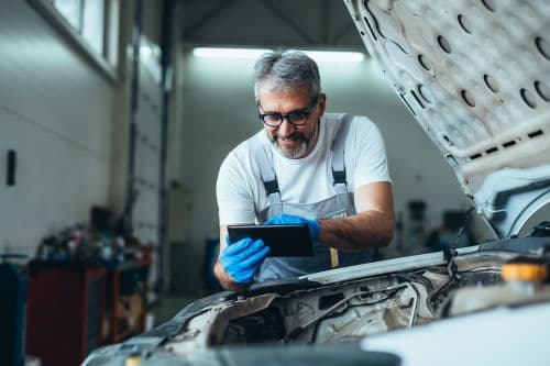 vehicle inspector using a manufacturing vehicle maintenance software for daily maintenance checks