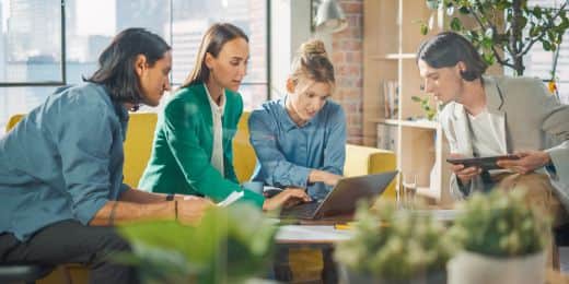 team of workers performing a life cycle assessment on their products during a meeting