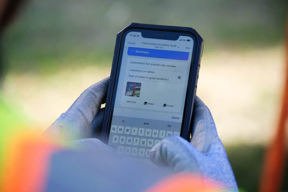 A man using a safety communication tool to update coworkers