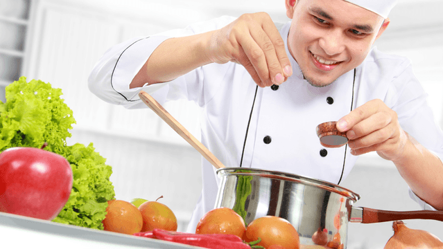 Chef preparing food using an allergen changeover verification checklist