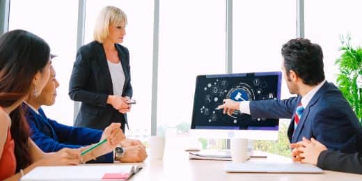 a group of organizational leaders discussing regulatory compliance examples to follow