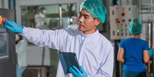 food technician referring to a foodborne illness complaint form to investigate their products