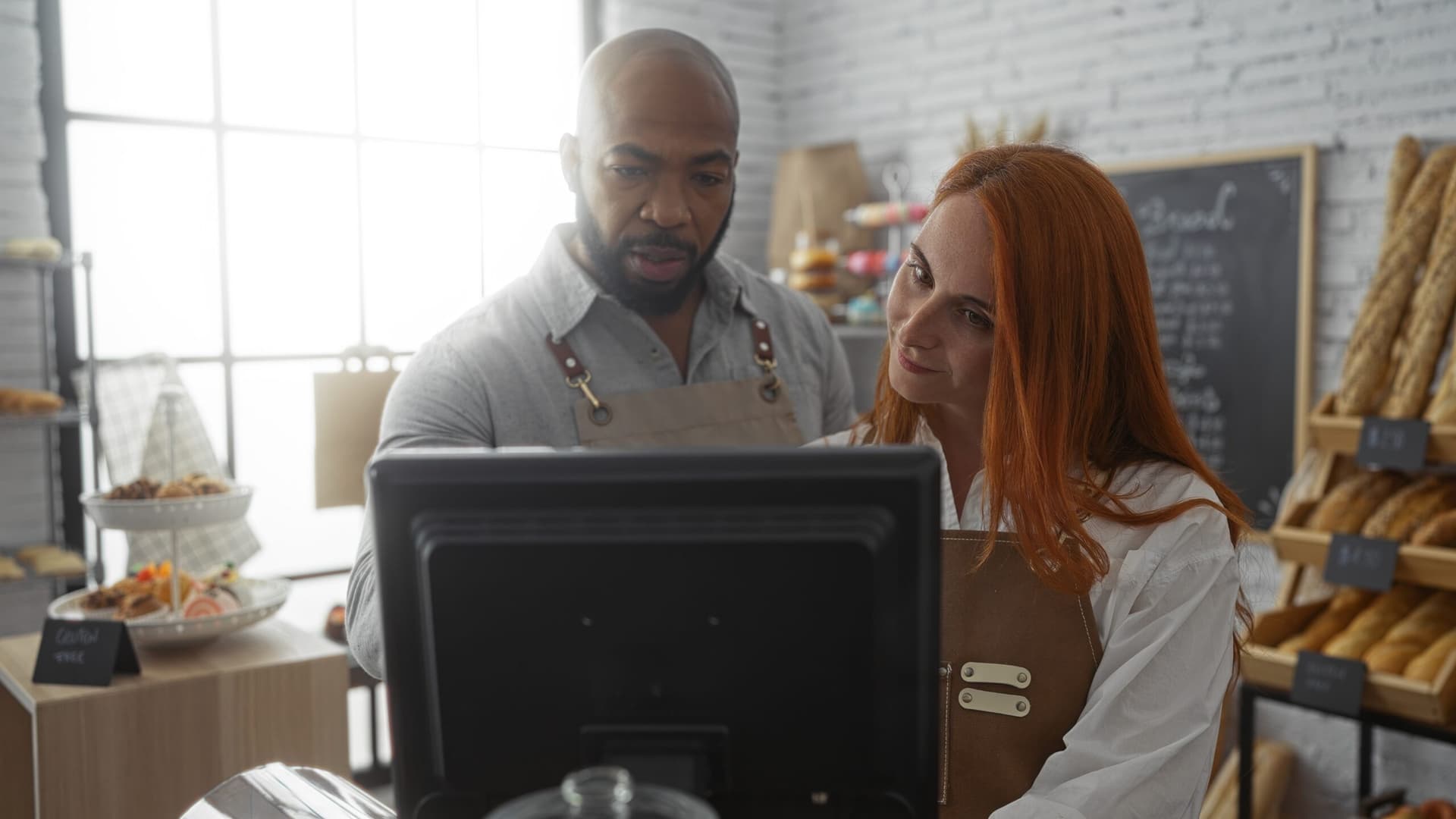 A manager managing assignments using retail task management software