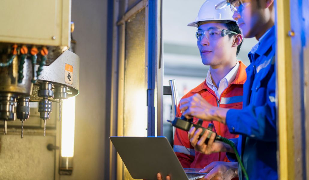 Utility workers using digital checklists on a tablet