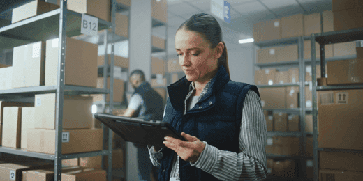 Female worker using inventory management skills in the warehouse