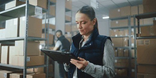 Female worker using inventory management skills in the warehouse
