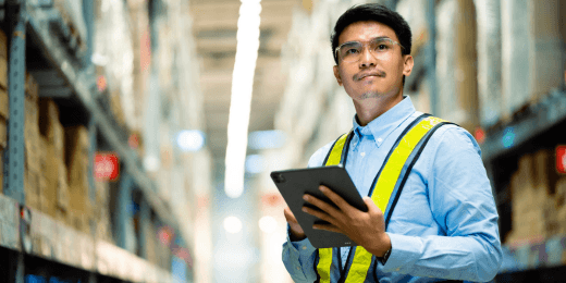 A shopkeeper performing maintenance checks using a retail store maintenance checklist