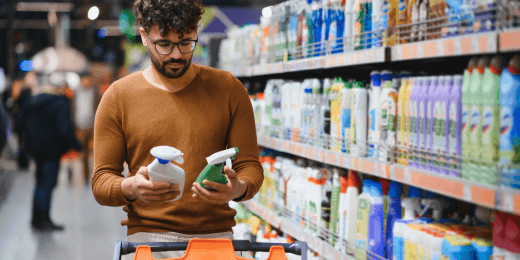Shopper comparing two different retail products.