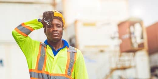 person working outdoors with a heat illness prevention checklist