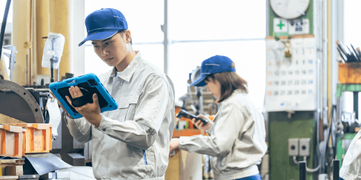 Two manufacturing workers in the production line