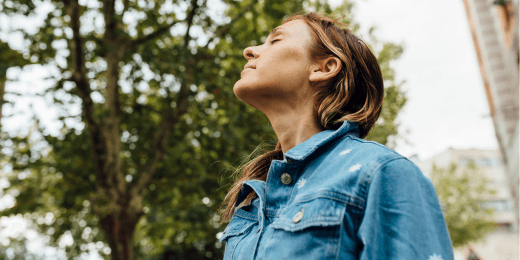 A woman breathing in the air.