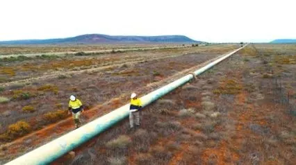 pipeline engineers inspecting for corrosion