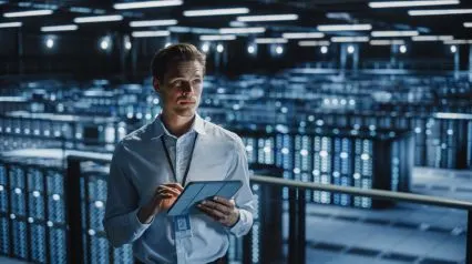 an IT security professional checking security systems using a security audit checklist on a tablet|Security Audit Checklist Sample Report|Security Audit Checklist