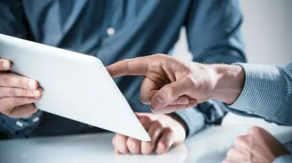 two people using an audit plan template on a tablet|Audit Plan Template Sample Report|Audit Plan Template